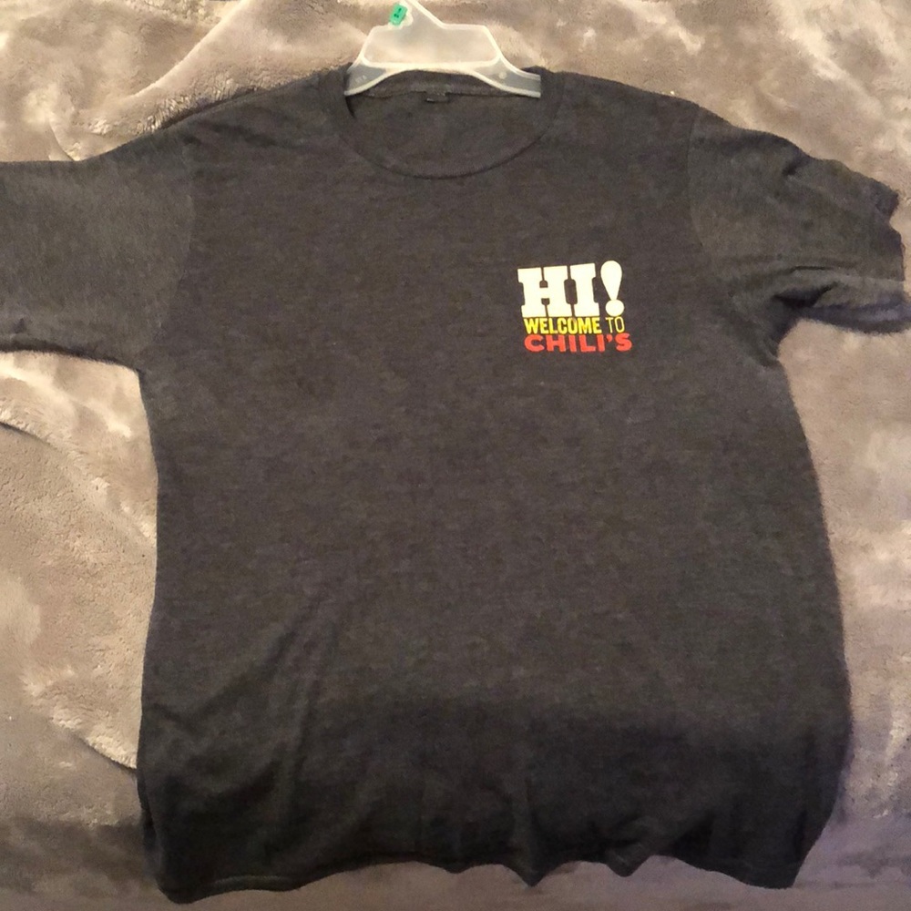 Chili’s work shirt.